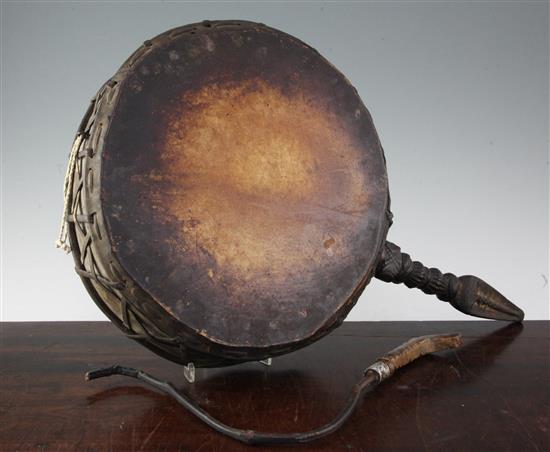 A Nepalese Dhyangro shamans carved wood and goatskin drum, 19th century 59cm